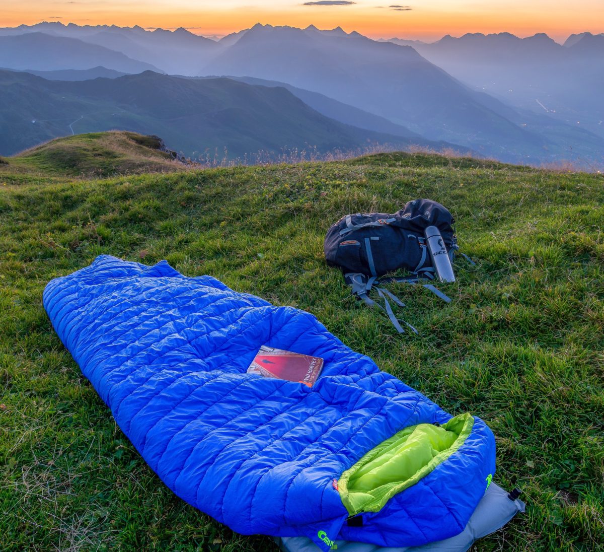 Backpacking sleeping bag on top of mountain.