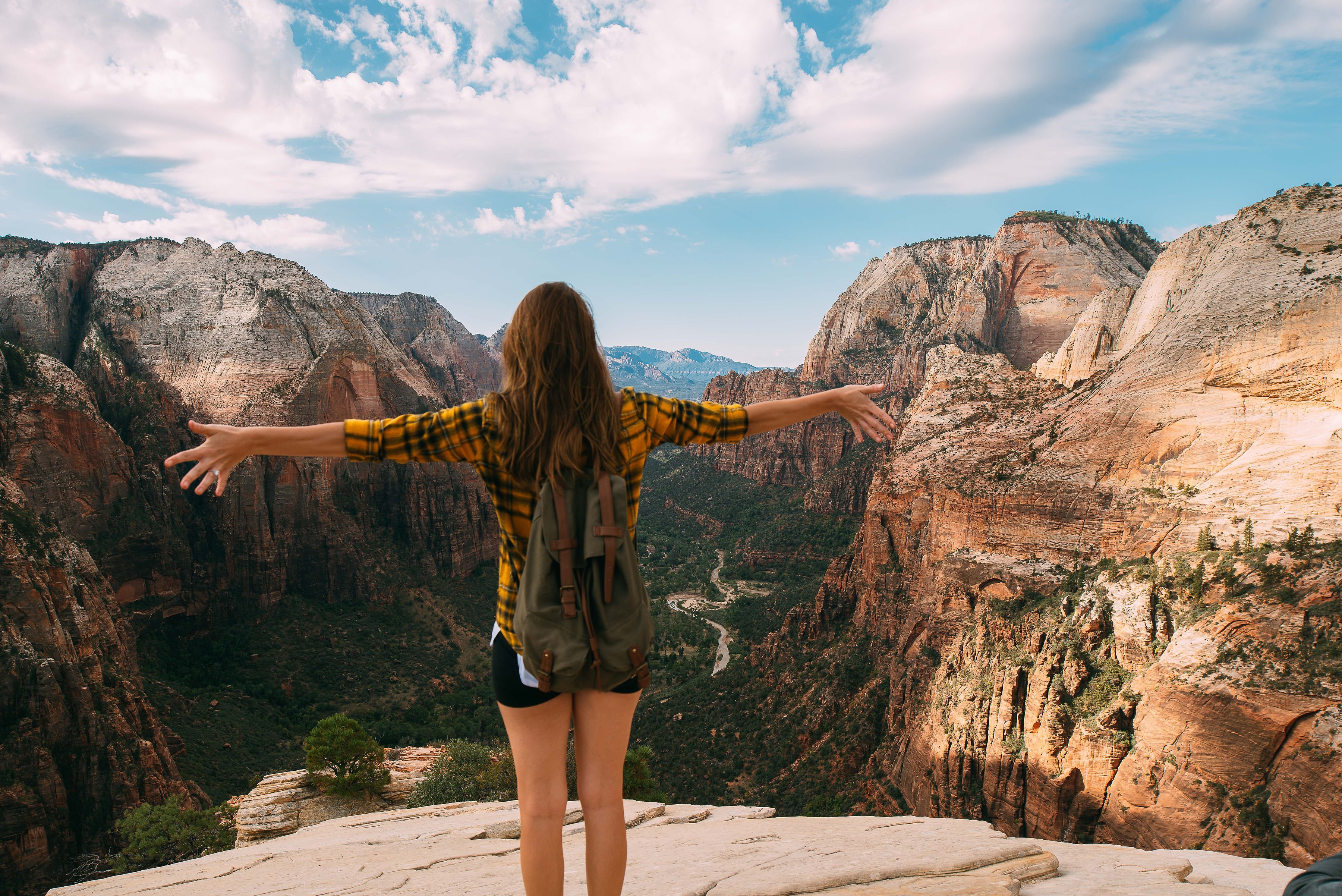 Woman on top of mountain for hike outside