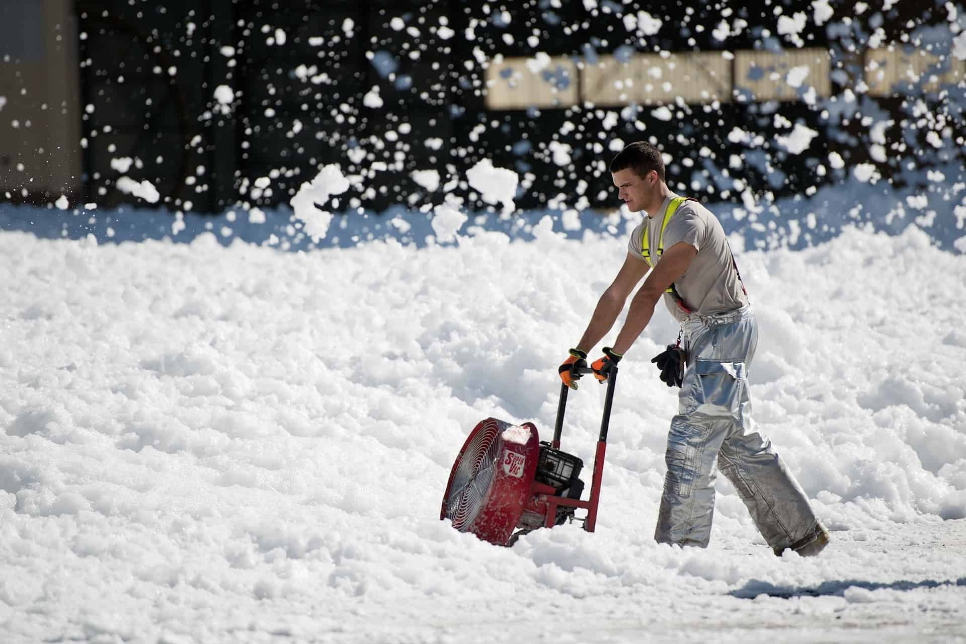 Man using snow thrower