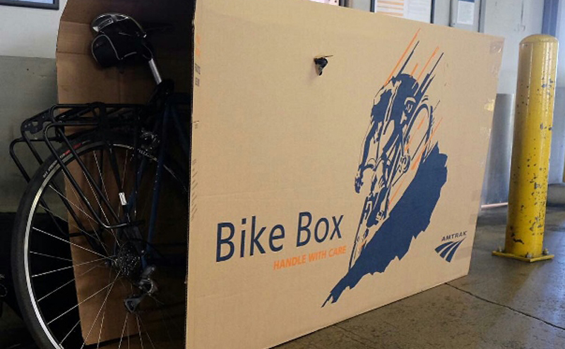Amtrak bike box with bike coming out one side.