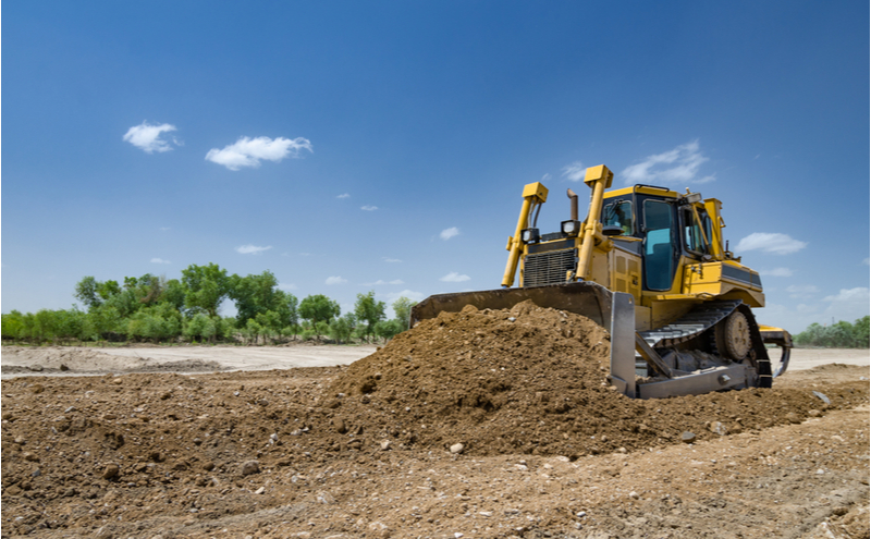 Bulldozer leveling the ground.