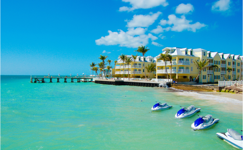 An oceanside view of the Beach Resort with jet skis.