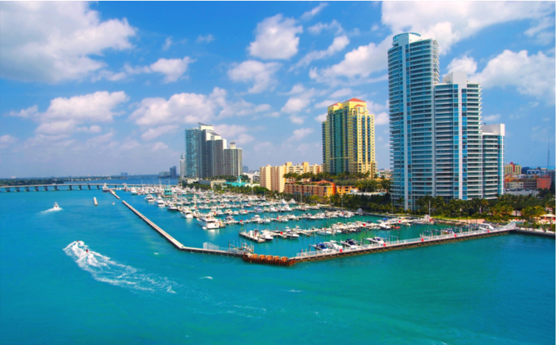 Jet ski and boat sailing next to South Miami Beach