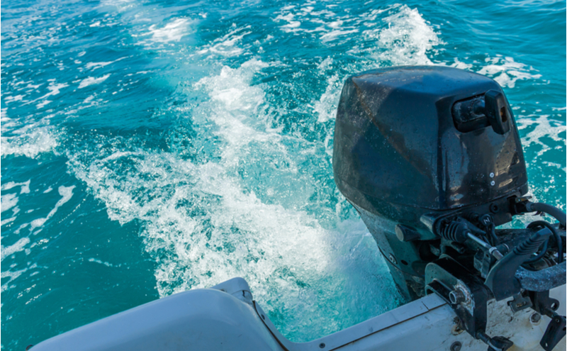 Trail on water behind motor boat.