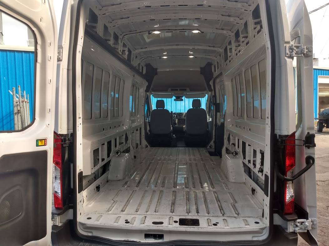 Ford transit cargo van extended high roof empty cargo view.