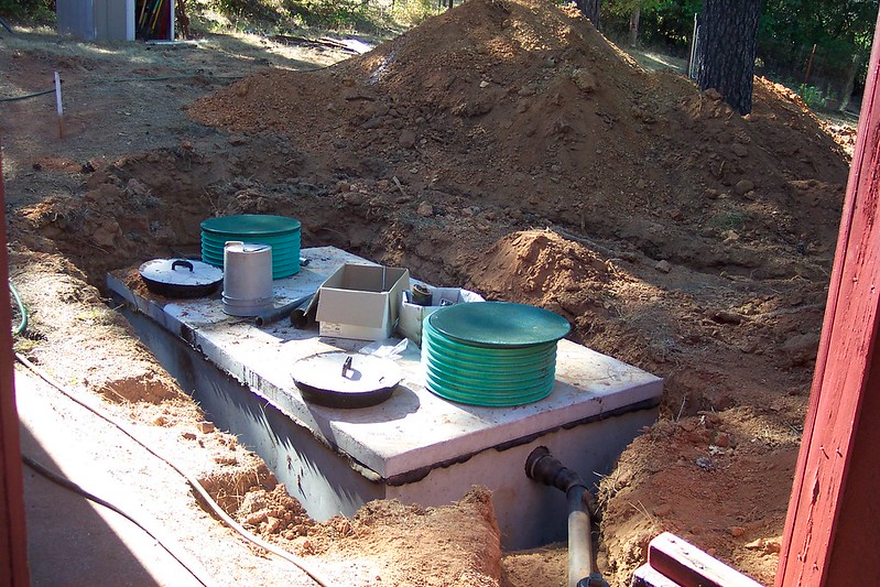 Septic tank in ground.